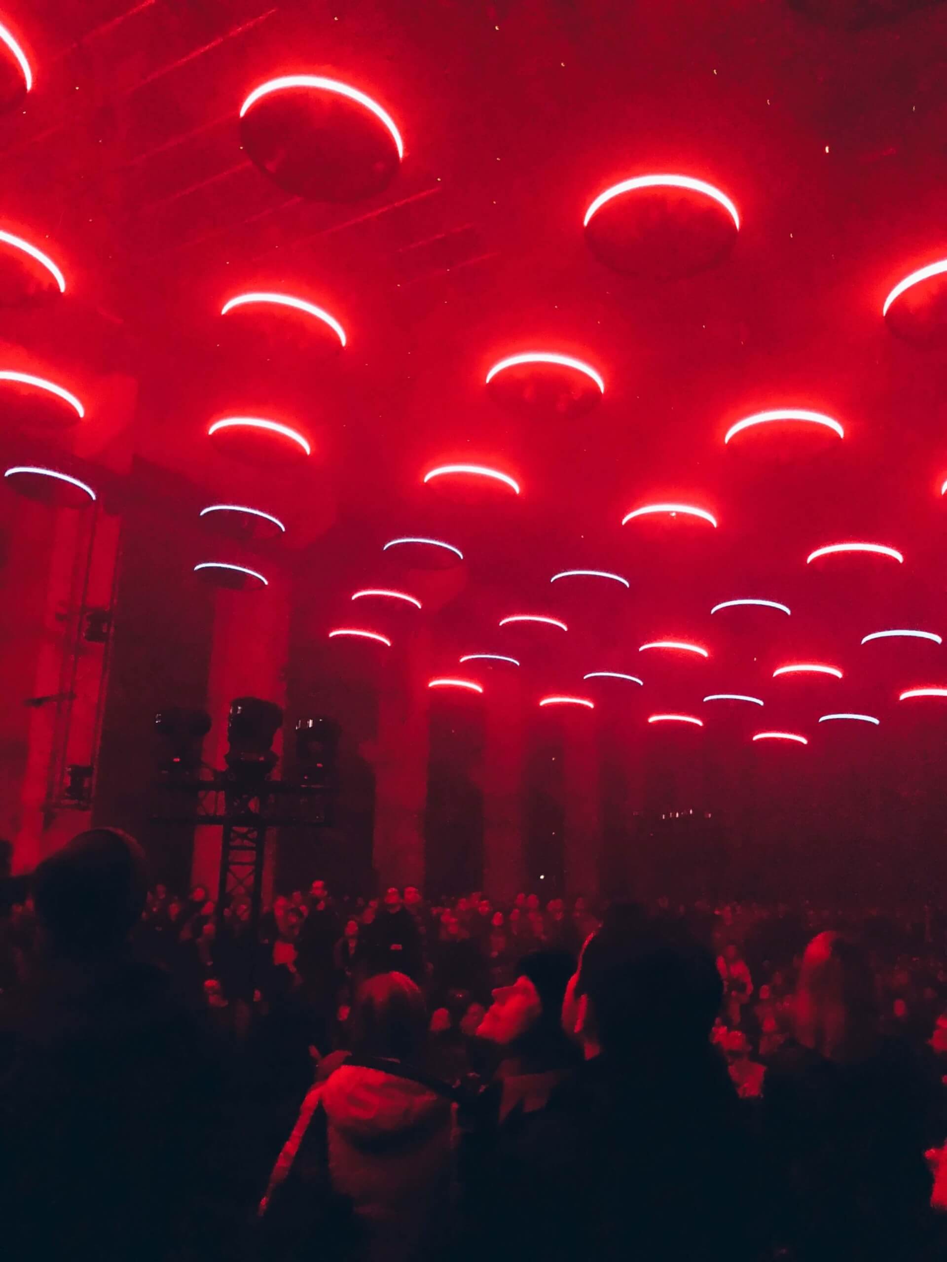 circular-red-lights-above-crowd